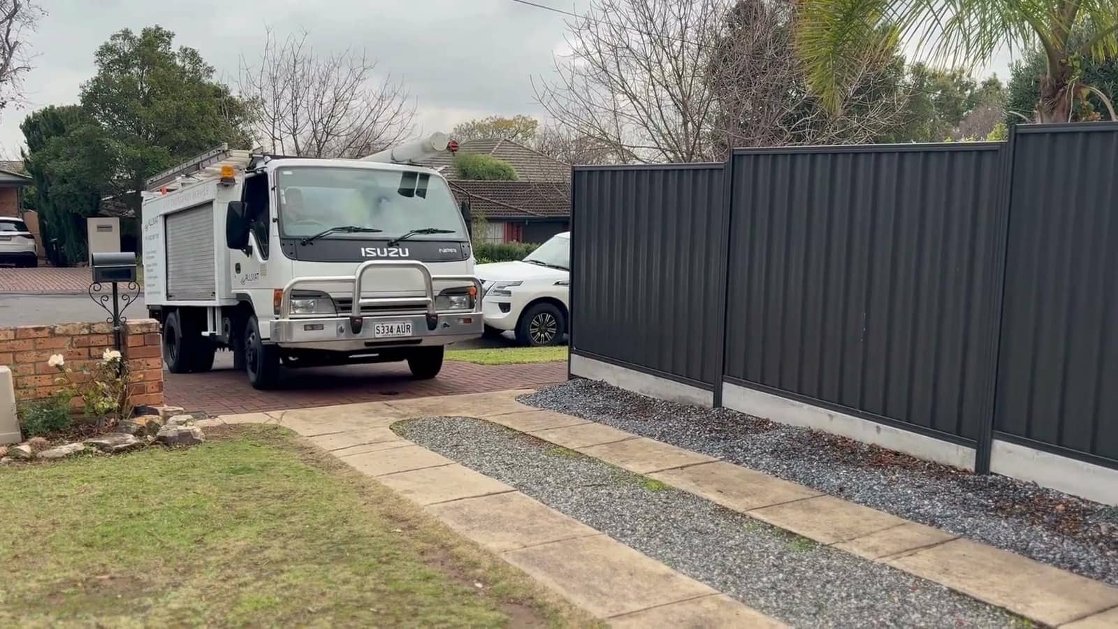 An Allmat Plumbing service truck parked in an Adelaide driveway